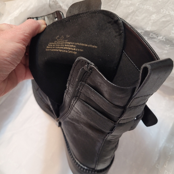 DKNY Buckled Straps Accent Combat Boots. Black Leather and Silver-Tone Metal. 7. - Picture 12 of 15